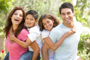 Portrait of Happy Family In Park